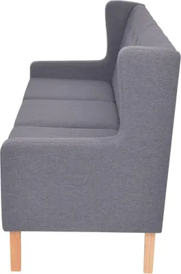 Side view of a gray three-seater sofa with wooden legs.