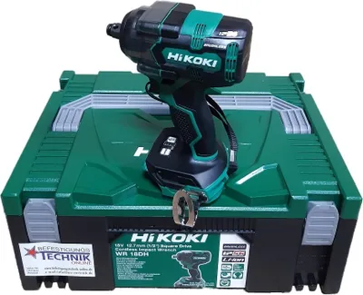 A HiKOKI cordless impact wrench is placed on top of its green storage case.