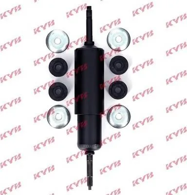 A shock absorber and its accompanying parts are laid out on a white background.