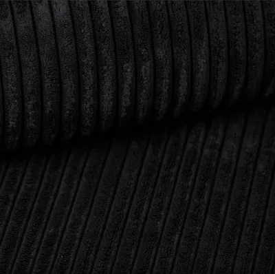 A close-up view of black corduroy fabric.