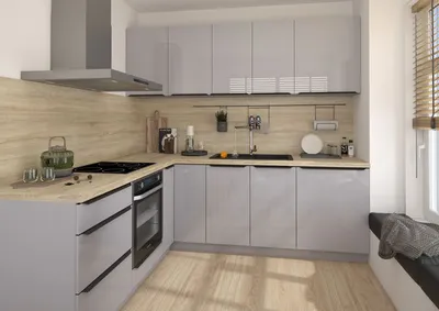 A modern L-shaped kitchen with gray high-gloss cabinets and a light wood backsplash.
