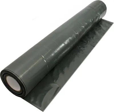 A roll of dark gray construction film is shown diagonally against a white background.