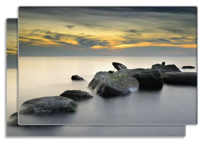 Produktbild von Wallario Frühstücksbrettchen 2er Set aus Glas, je 20 x 30 cm, mit rutschfesten Füßen, Motiv Mystische Felsen im Meer