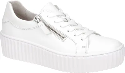 A white leather platform sneaker with a side zipper.