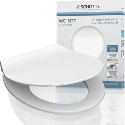 A white toilet seat is displayed in front of its packaging.