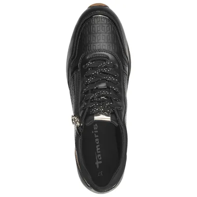 A top-down view of a black Tamaris sneaker.