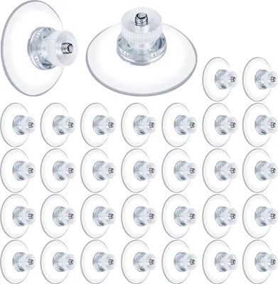 A collection of clear suction cups with threaded screws.