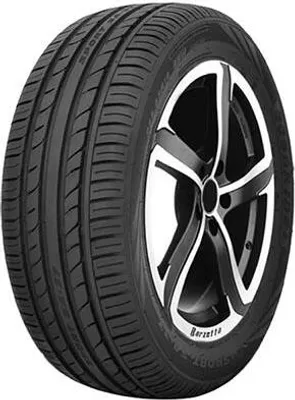 A close-up studio shot of a car tire mounted on a black and silver alloy wheel.