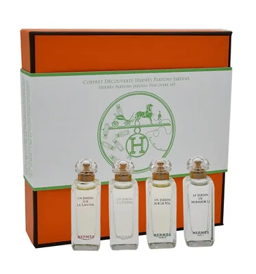 A set of four small perfume bottles in a gift box.