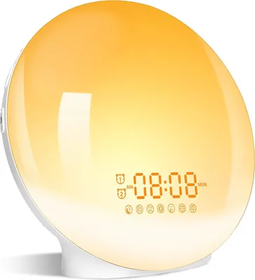 A white alarm clock with a glowing orange light and a digital display showing the time.