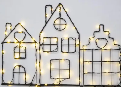 A close-up of a decorative wireframe house outline with integrated LED lights.