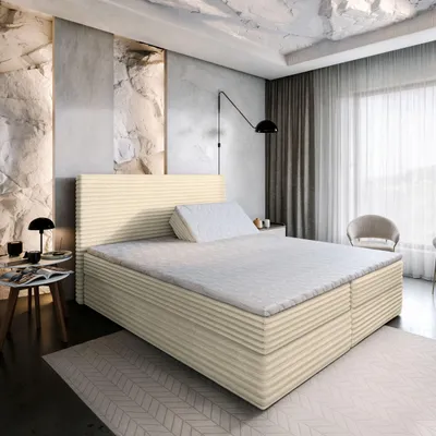 A bedroom scene featuring a bed with a headboard, mattress, and topper, along with bedside tables and a chair.