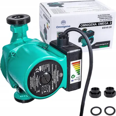 A green water pump with its packaging and accessories, presented on a white background.