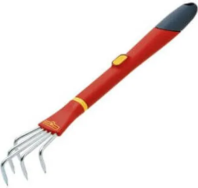 A garden rake with a red handle and silver tines, isolated on a white background.