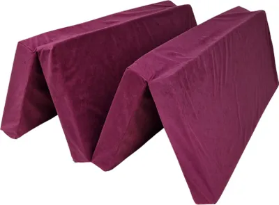 A folded purple mattress shown from a diagonal angle against a white background.