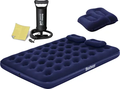 A navy blue inflatable mattress with two pillows, a hand pump, and a patch kit, all arranged on a white background.