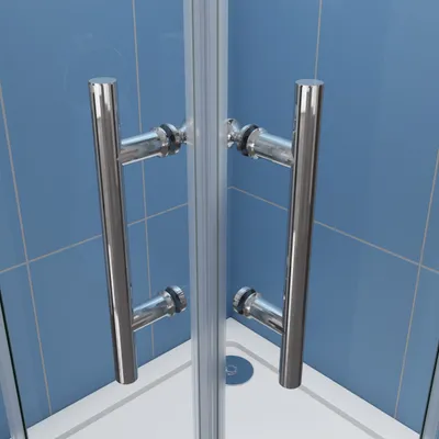 Close-up view of a shower door with chrome handles and blue tiled walls.