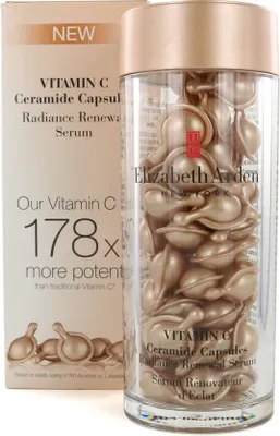 A bottle of Elizabeth Arden Vitamin C Ceramide Capsules next to its box.