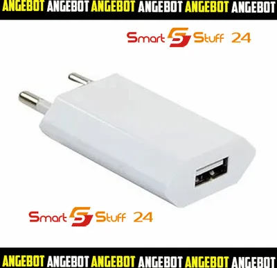 A white USB power adapter with two prongs for plugging into a wall socket.