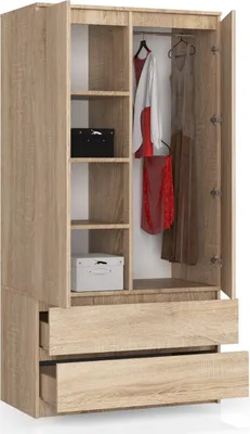 An open wardrobe with clothes hanging inside and shelves with boxes.