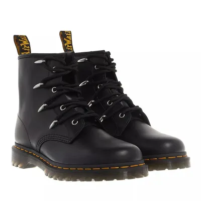 A pair of black Dr. Martens boots.