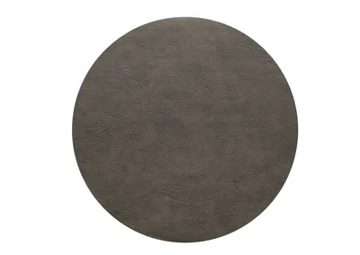 A round placemat with a textured surface.