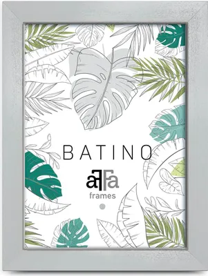A framed picture with a tropical leaf pattern.
