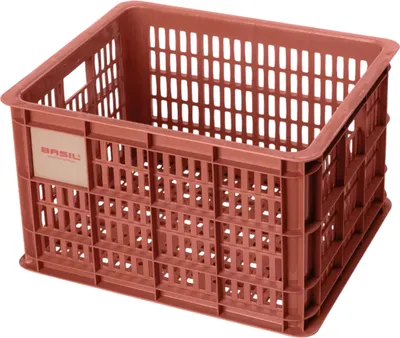 A brown plastic crate with a label on the side.
