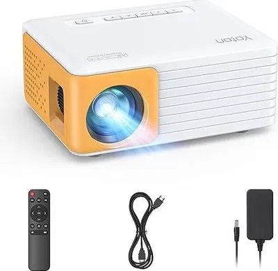 A white and orange mini projector with its accessories laid out below it on a white background.