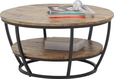 A round coffee table with two tiers, made of wood and metal, is shown against a white background.
