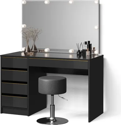 A black vanity table with a lighted mirror and a stool, set against a white background.