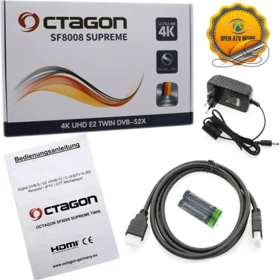 The image shows the packaging of a digital receiver along with its accessories and a manual.