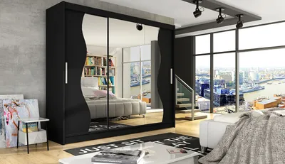 A modern bedroom with a large black wardrobe with mirrored doors, a bed, and a large window overlooking a city skyline.