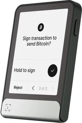 A cryptocurrency hardware wallet displaying a transaction confirmation screen.