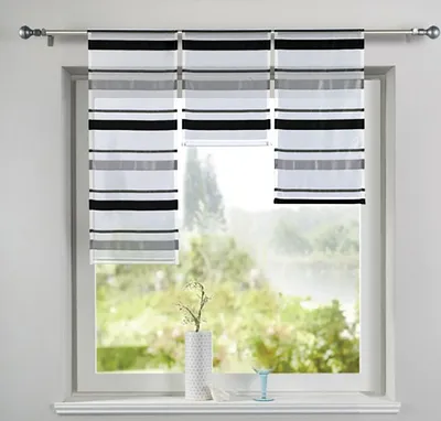 A window with striped curtains and a vase on the windowsill.