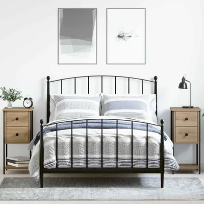 A bedroom scene with a bed, nightstands, and artwork.