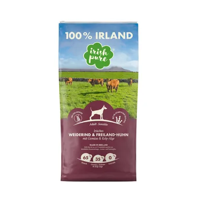 A bag of dog food with an image of cows in a field on the front.