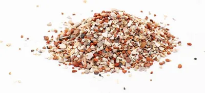 A pile of grit on a white background.