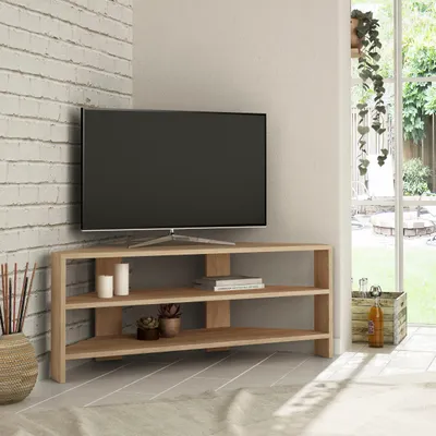 A television on a corner TV stand in a living room.