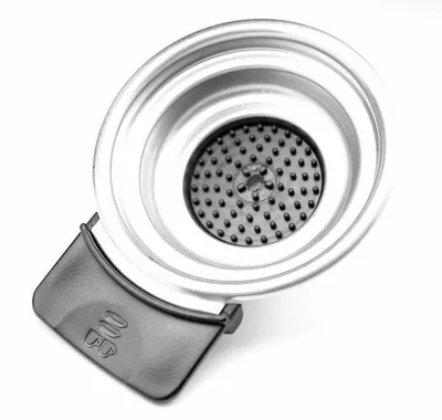 A close-up, top-down view of a coffee machine filter holder.