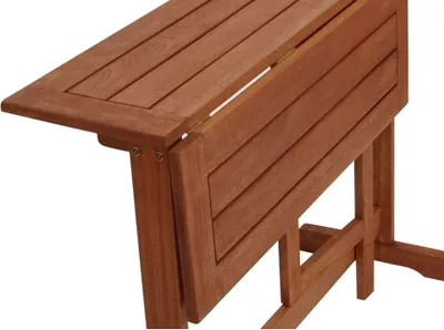 A close-up view of a wooden folding table.