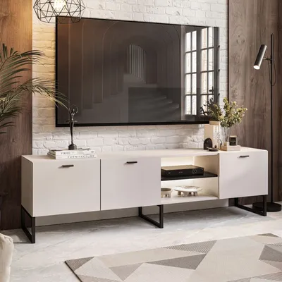 A modern living room with a TV stand and television.