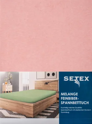 A product image showing a pink fabric and a bed with a green fitted sheet.