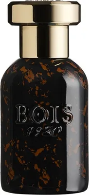 A perfume bottle with a black and brown speckled design and a gold cap.