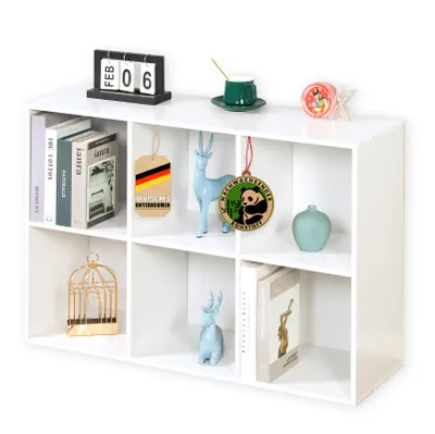 A white modular shelf unit filled with various decorative items and books.