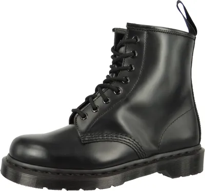 A black Dr. Martens boot is shown against a white background.