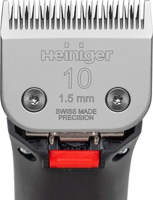 Close-up of a hair clipper blade with branding and specifications.