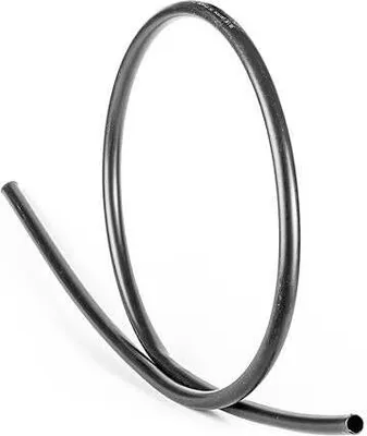 A black plastic tube is coiled on a white background.