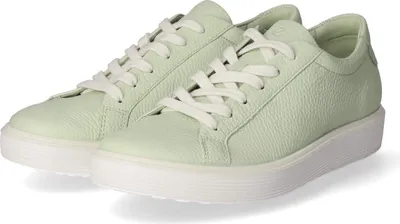 A pair of light green low-top sneakers with white laces and white soles, shown from a slightly elevated side angle against a white background.