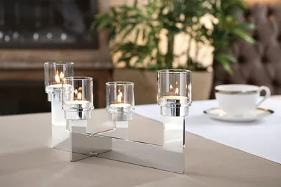 Imagen del producto de Soporte para velas tipo "Teelicht" de Fink, para 4 velas, plateado, dimensiones 30x16, altura 10, referencia 138071